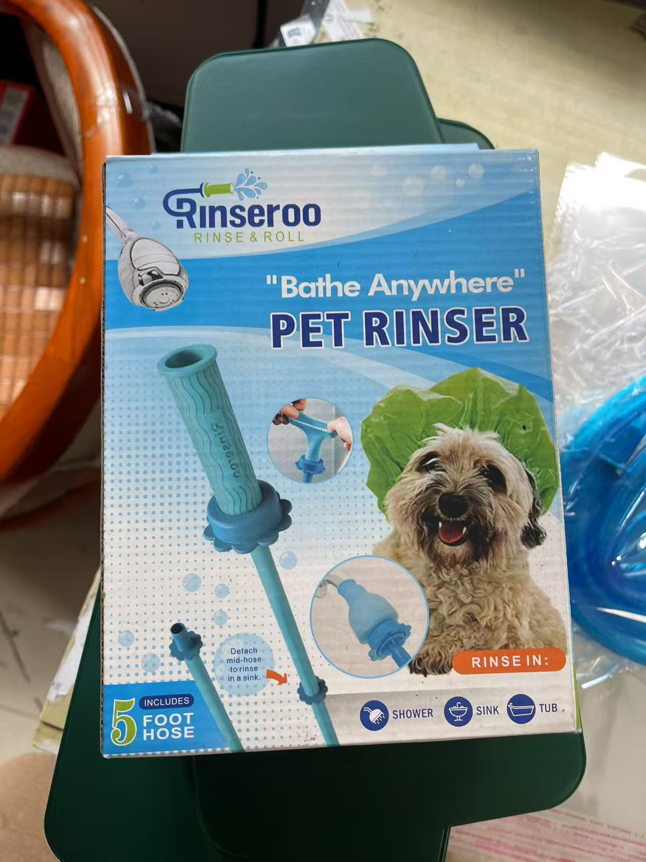 Close up of the rounded plastic spray head and reinforced hose for pet bathing