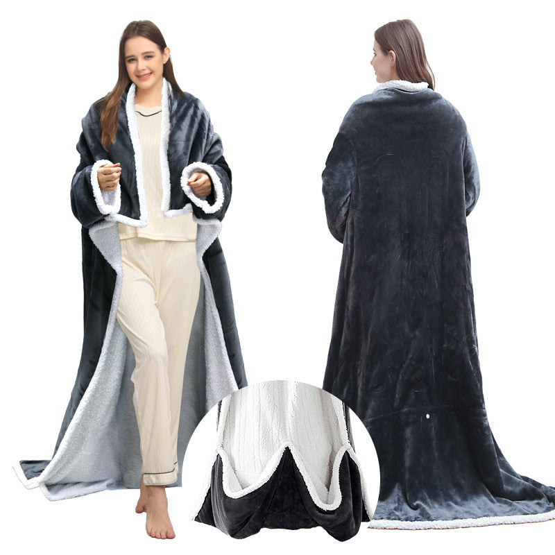 Scale view of the wearable heated blanket held next to a hand