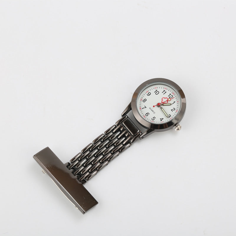 Nurse fob watch shown at an angle with the red seconds hand and outer seconds track on the dial