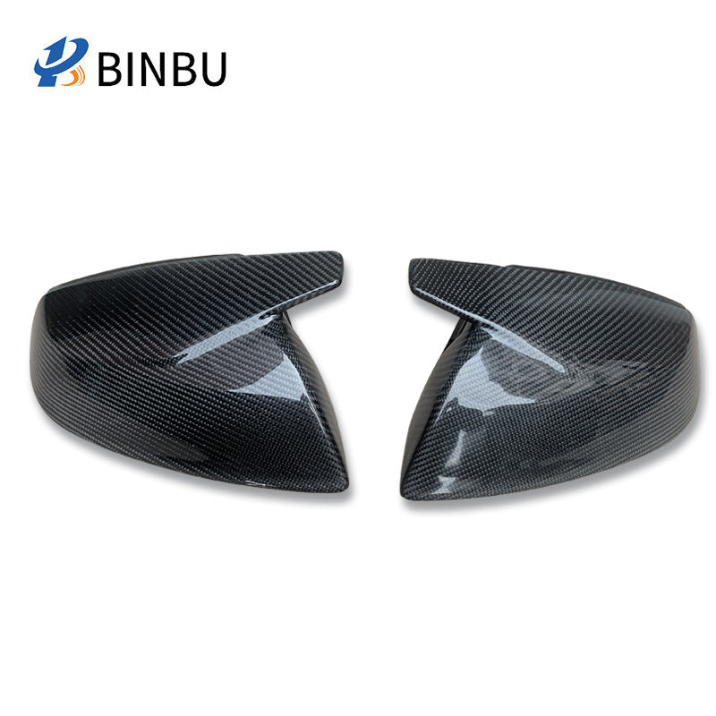 Pair of glossy carbon weave horn-style side mirror covers, left and right, on a white background