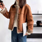 Cropped faux fur jacket worn open over a knit, brown tone