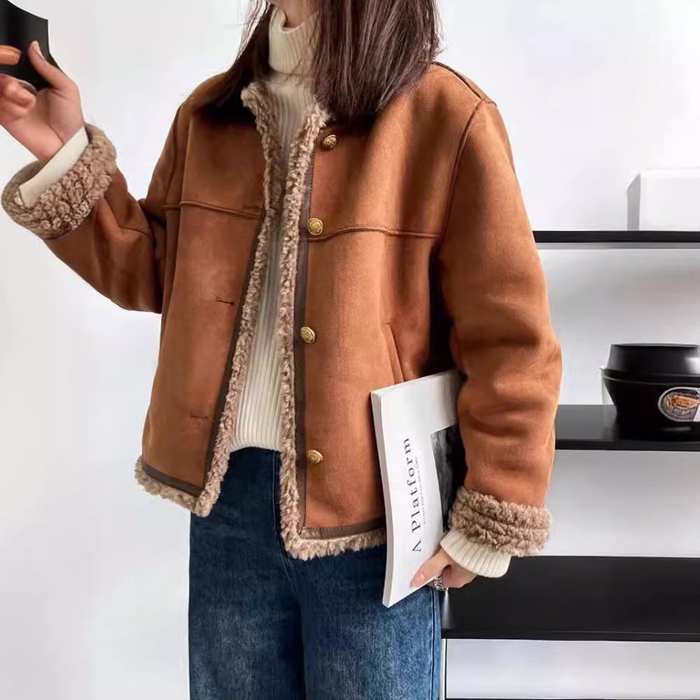 Cropped faux fur jacket worn open over a knit, brown tone