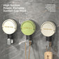 Cream, green and white suction cup hooks on a gray marble wall holding a cord and a wooden brush