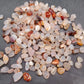 Larger tumbled agate stones in mixed colours for landscaping accents
