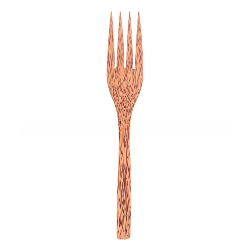 Coconut wood fork with a speckled brown grain on a white background