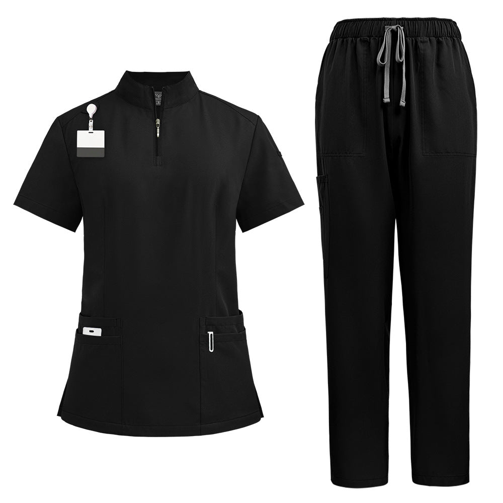 Womens scrub top in brown shown flat to display the stand collar, quarter zip and hip pockets