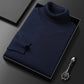 Men's slim-fit turtleneck sweater shown folded in a gift box