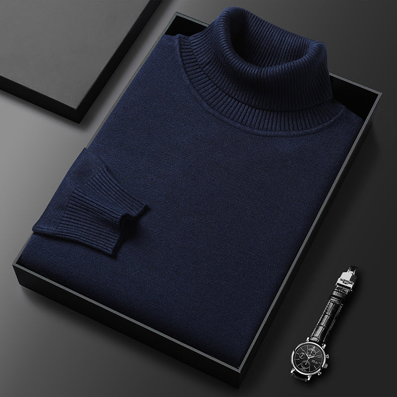 Men's slim-fit turtleneck sweater shown folded in a gift box