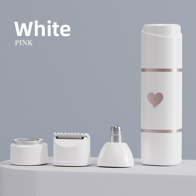 White mini shaver body on a grey podium beside its foil, blade and nose heads
