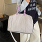 Oxford travel duffel with the base expansion zip opened for extra capacity