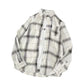 White plaid oversized shirt laid flat showing collar, placket, and pocket