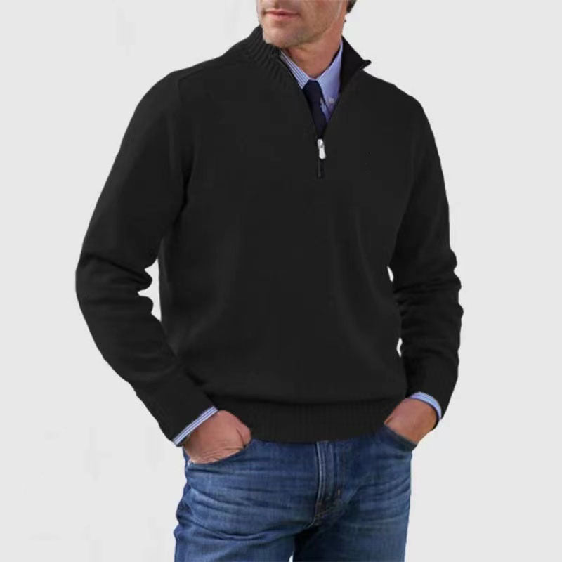 Black mens acrylic knit quarter zip stand collar pullover sweater worn by a standing male model