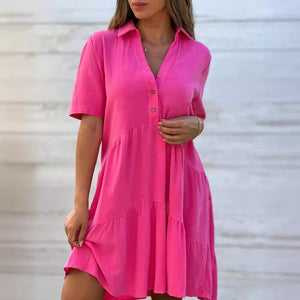 Yellow green short sleeve cotton and linen tiered shirt dress showing the tiered A line skirt and short sleeves