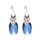 Bohemian tassel and bead clip-on drop earrings, aged tone zinc alloy frame, handmade pair on plain white background