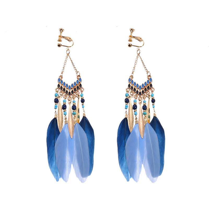 Bohemian tassel and bead clip-on drop earrings, aged tone zinc alloy frame, handmade pair on plain white background