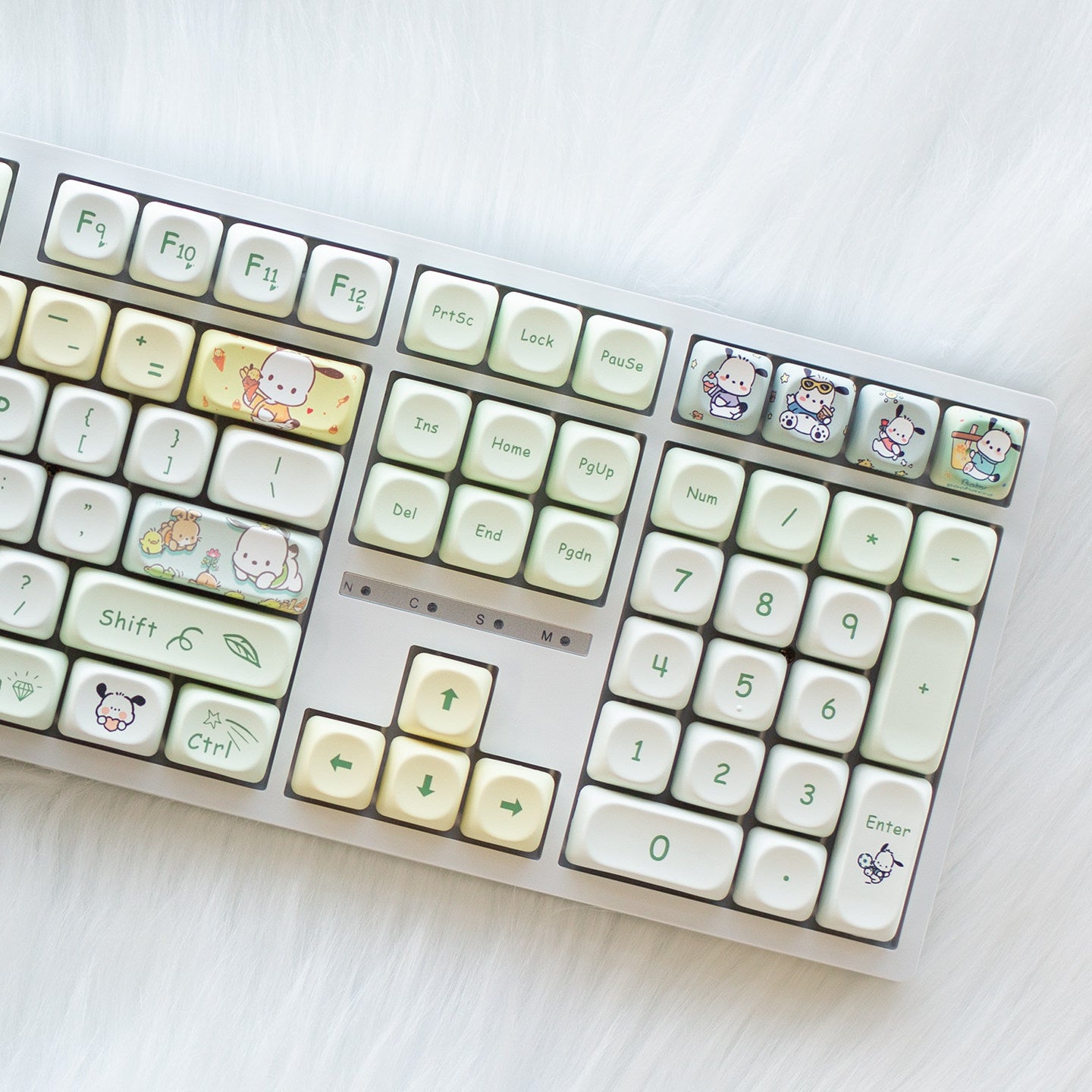 Milk-green Xiu dog keycaps on the number pad and arrow keys of the white 108-key keyboard