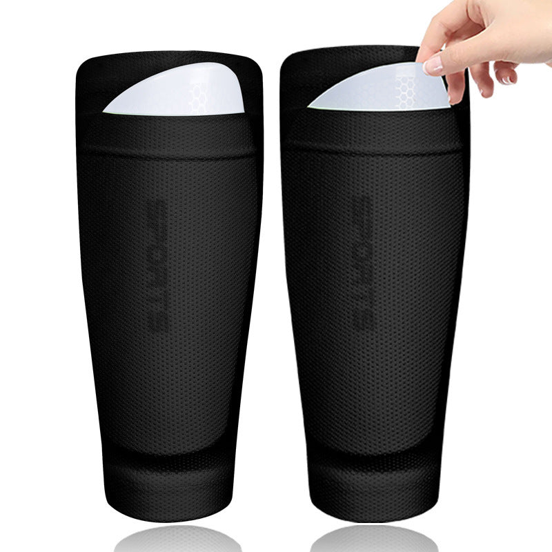 Black double layer soccer shin guard sleeves with a hand inserting a guard plate, Black option, size Children's S