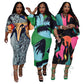 Abstract print pleated midi dress with batwing sleeves and V neck, side view