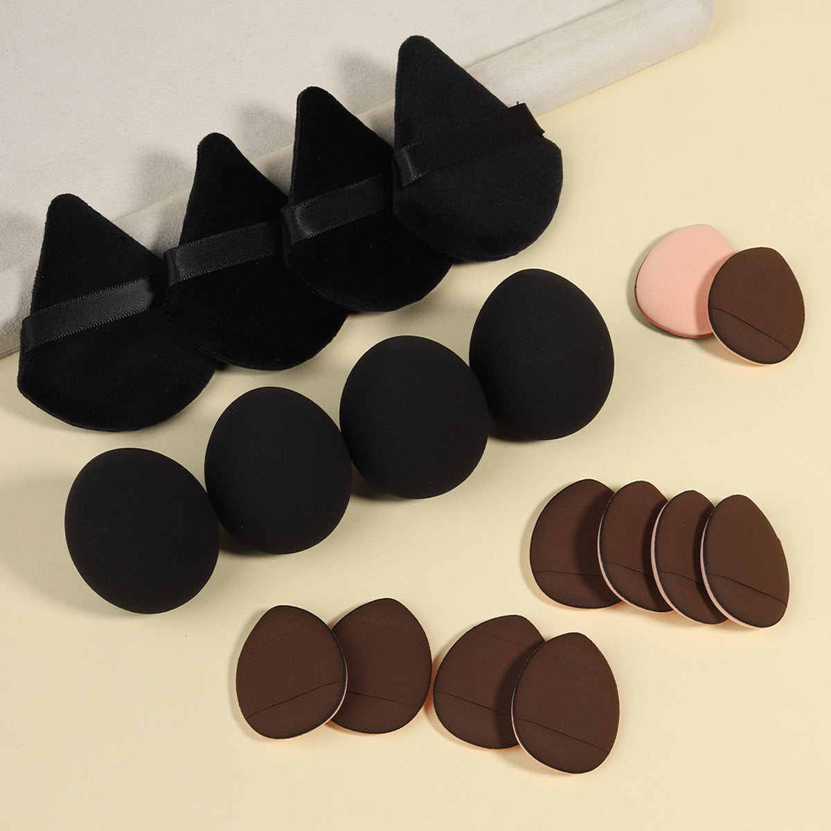 Makeup sponge and powder puff set with foam blenders and velvet puffs in matching tones