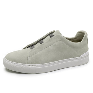 Mens slip on suede sneaker low top with white rubber cupsole side profile view