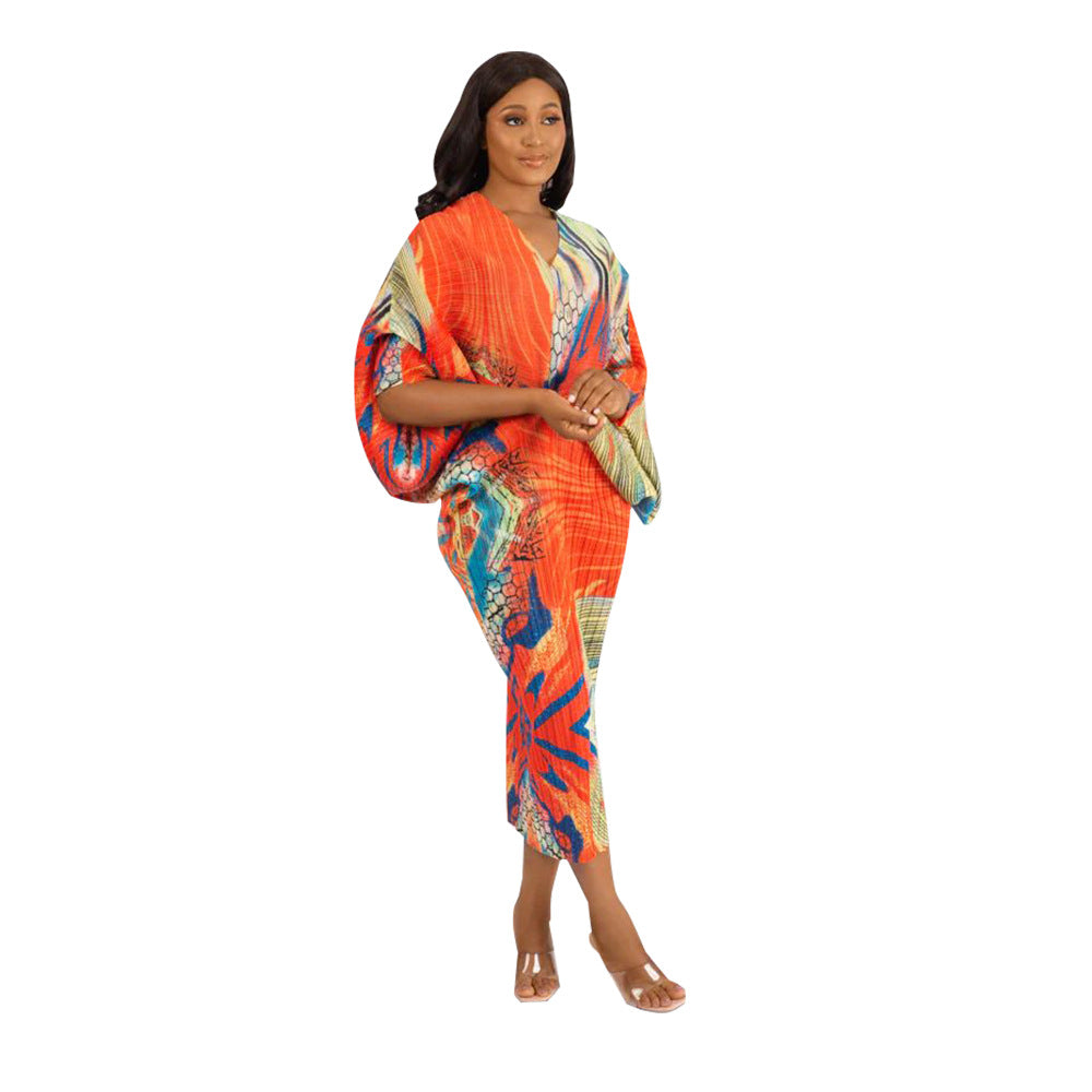 Colorful abstract print pleated batwing V neck midi dress on a model, full length front