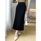 Ribbed wool pleated midi skirt shown in four color options