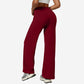 Wine red high-waist flared wide-leg yoga pants side view on a model in a white studio