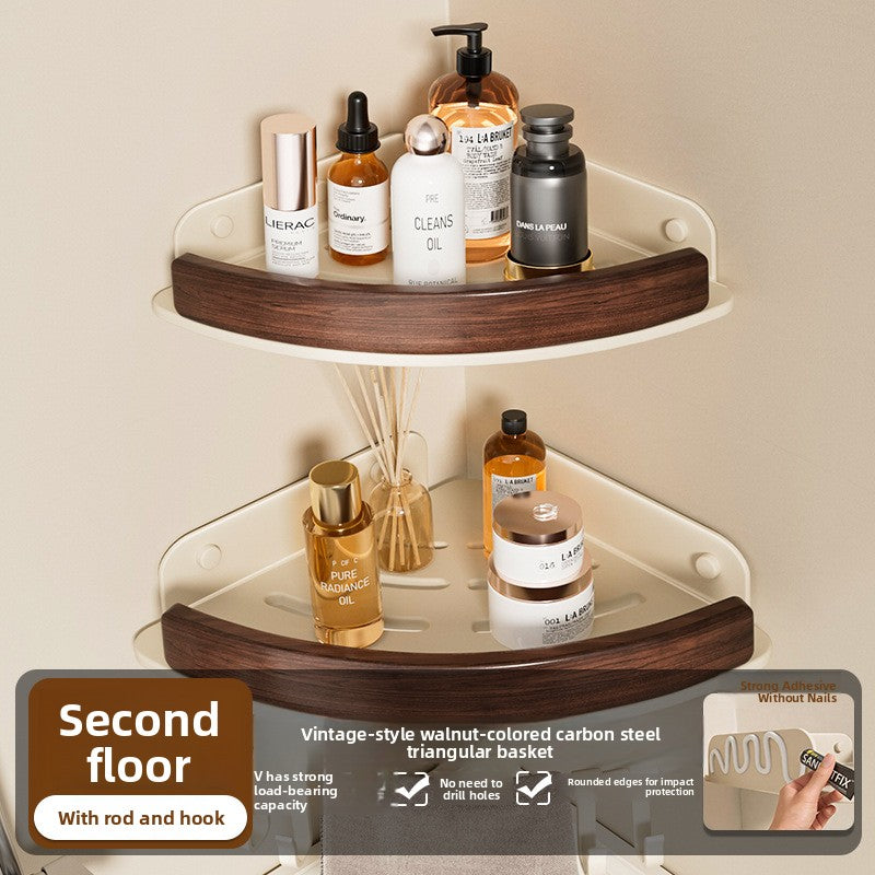 Black walnut fan shaped bathroom corner shelf mounted in a tiled corner with bottles