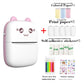 Pink cat ear thermal printer next to colored paper rolls, print paper, sticker rolls and watercolor pens in a bundle photo
