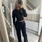 Womens two piece lounge set, a front zip jacket and straight leg drawstring pants in a soft sweat knit