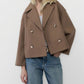 Army green short double breasted wool coat with wide notch lapels worn open