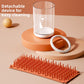 Pet paw wash cup taken apart into the clear body, the white collar ring and the bristle mat