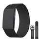 Black screenless smart bracelet on a woven strap with a spare perforated silicone strap alongside