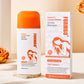 Shampoo bottle and carton styled with dried orange roses on a soft cream surface