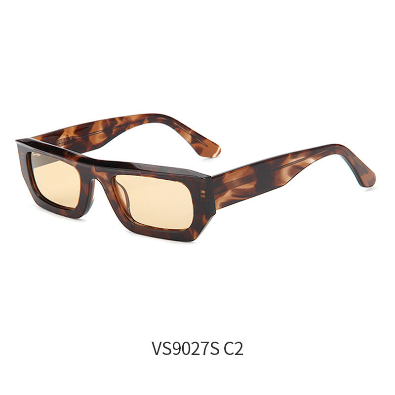 Folded retro sunglasses resting inside the hard protective case