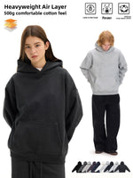 Heavyweight hoodie marketing image with a woman in a charcoal hoodie, a man in a gray hoodie and a row of color swatches