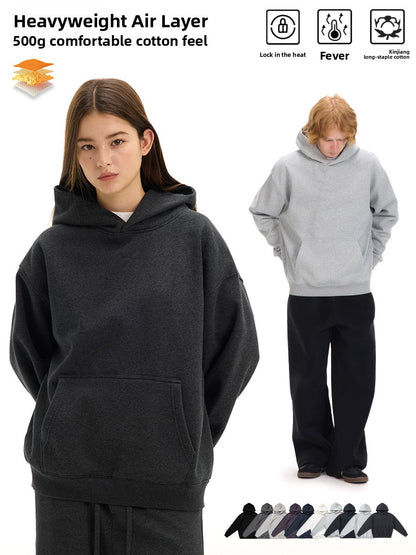 Heavyweight hoodie marketing image with a woman in a charcoal hoodie, a man in a gray hoodie and a row of color swatches