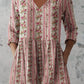 Boho print V neck tunic top worn loose with three quarter sleeves