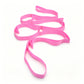 Rolled up yoga stretch strap coiled small to show its packable travel size