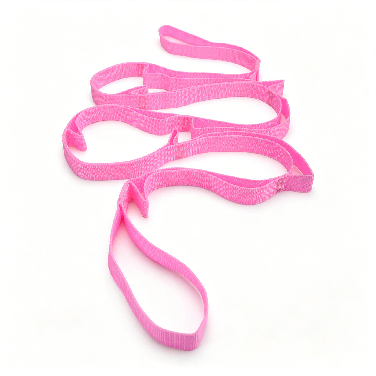 Rolled up yoga stretch strap coiled small to show its packable travel size