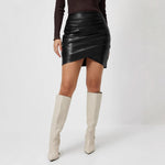 Brown short-sleeve draped women's top styled in a lifestyle setting