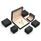 Black jewelry box group with a large open set box and four small boxes, long chain box option