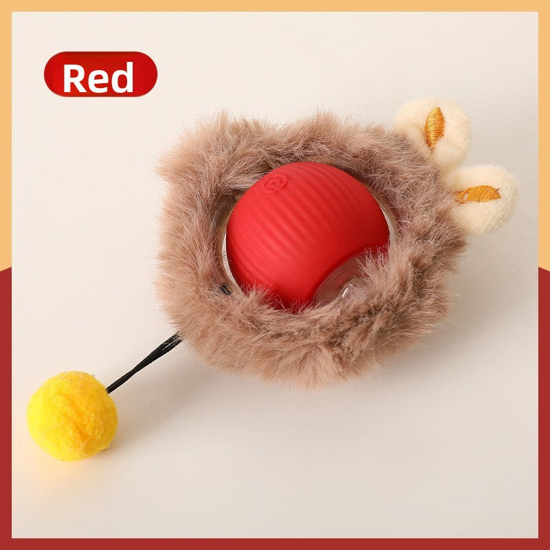 Red rolling cat ball set in a brown plush ring with embroidered ears and a yellow pompom on a wire