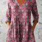 Digital print tunic with side pockets styled over white trousers