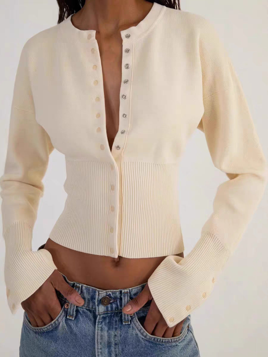 Brown rib knit cardigan on a model with the round neck and long sleeves
