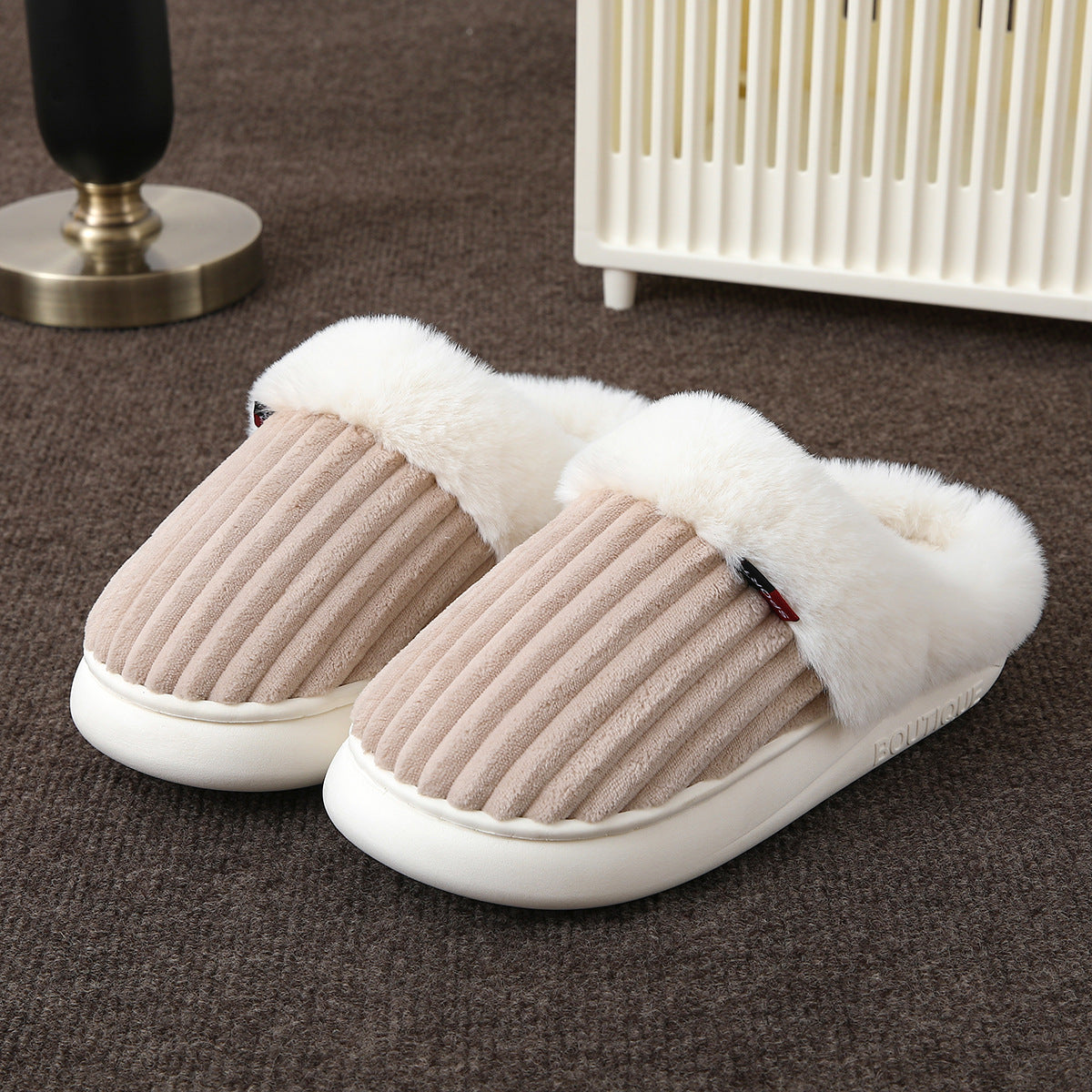 Close view of the soft plush cuff and the lining on the covered toe mule slipper edge