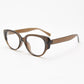 Translucent brown oval cat eye frame with clear lenses at an angle