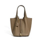 Leather bucket tote bag shown from a third angle on the strap