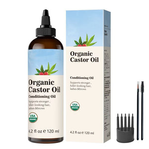 Rosemary hair oil bottle with pointed tip beside its dark blue box and two spoolie applicator brushes