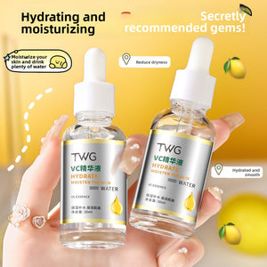 Two clear TWG VC essence dropper bottles held in a hand against a yellow background